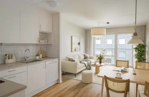 Stylad visningslägenhet: ljust kök och vardagsrum med matplats